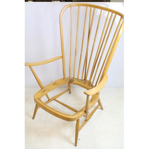 374 - Ercol stick back arm chair in need of restoration