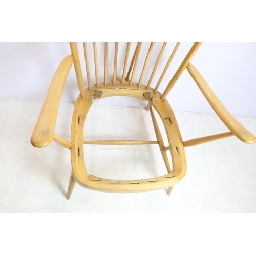 374 - Ercol stick back arm chair in need of restoration