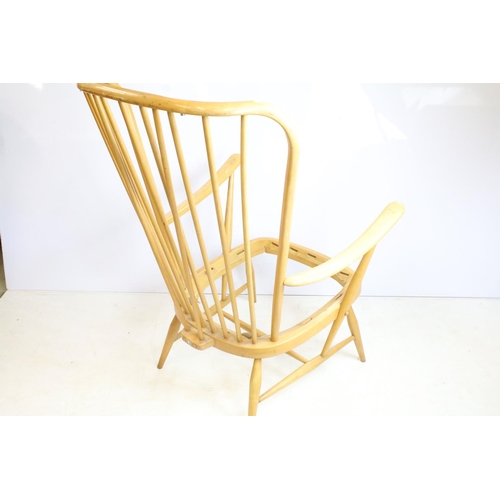 374 - Ercol stick back arm chair in need of restoration