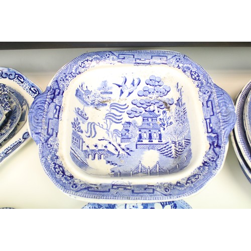 294 - Collection of blue and white pottery and porcelain, to include: various willow pattern, to include t... 