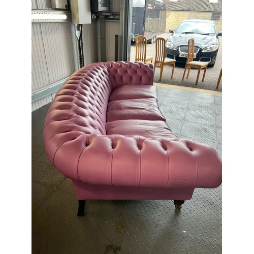 376 - Three seater lilac / pink leatherette contemporary Chesterfield sofa, with button back back and arms... 