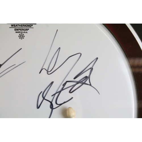 1593A - Memorabilia / Autographs - Motorhead framed and glazed display containing a drum skin signed by Lemm... 