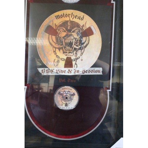 1593A - Memorabilia / Autographs - Motorhead framed and glazed display containing a drum skin signed by Lemm... 