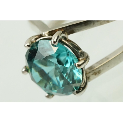 14 - 18ct white gold and zircon dress ring. The ring being set with a round brilliant cut blue zircon pro... 
