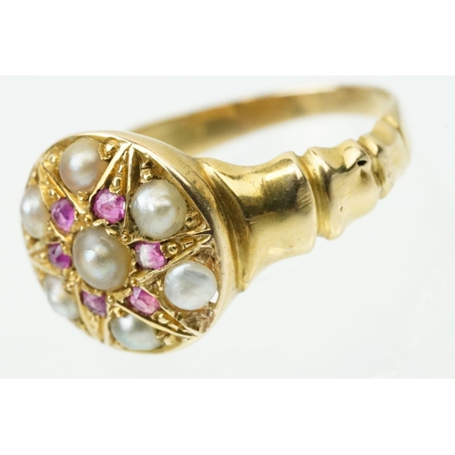 44 - 19th Century Victorian ruby and pearl ring. The ring having a round head with half pearls and six cu... 