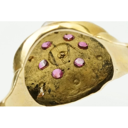 44 - 19th Century Victorian ruby and pearl ring. The ring having a round head with half pearls and six cu... 