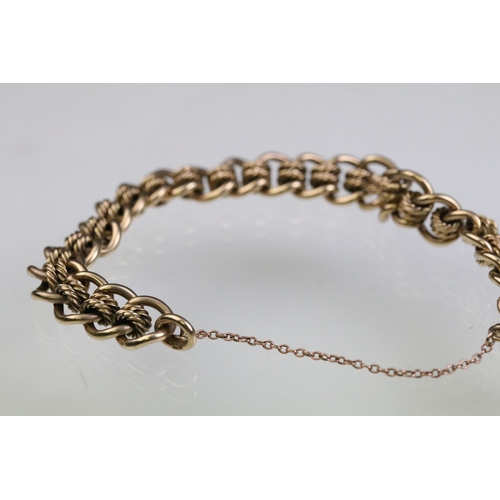 12 - 9ct gold fancy link bracelet chain having contrasting curb links and rope twist links with a tiger e... 