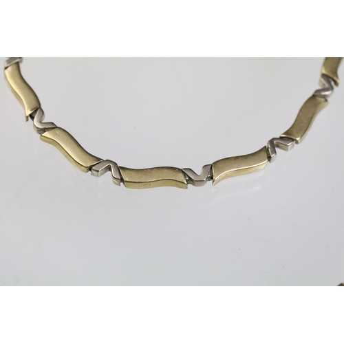 24 - 14ct gold necklace and bracelet suite each having curved bar links with v shaped spacer links. Marke... 
