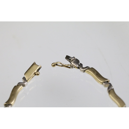 24 - 14ct gold necklace and bracelet suite each having curved bar links with v shaped spacer links. Marke... 