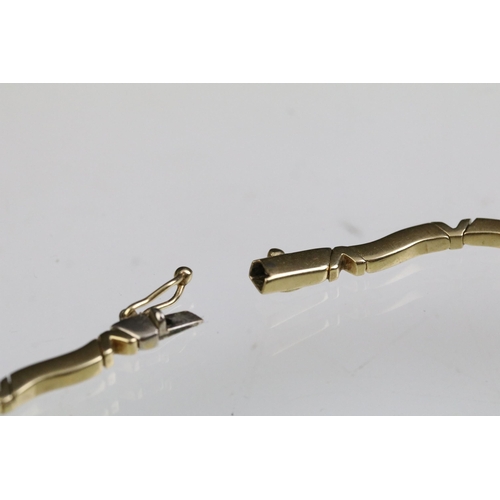 24 - 14ct gold necklace and bracelet suite each having curved bar links with v shaped spacer links. Marke... 
