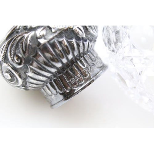 490 - Group of silver topped cut glass scent bottles including four of orb form and one square example. Ea... 