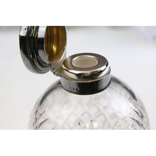 490 - Group of silver topped cut glass scent bottles including four of orb form and one square example. Ea... 