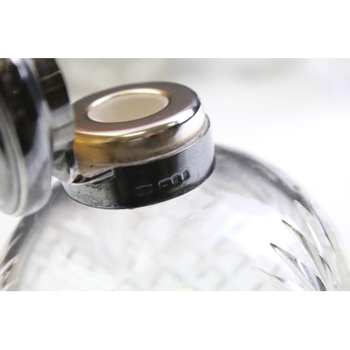 490 - Group of silver topped cut glass scent bottles including four of orb form and one square example. Ea... 