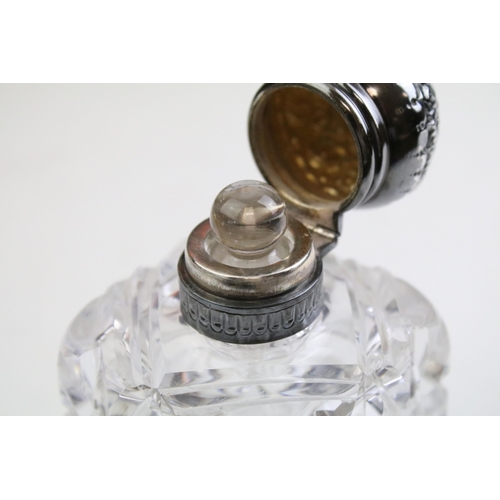 490 - Group of silver topped cut glass scent bottles including four of orb form and one square example. Ea... 