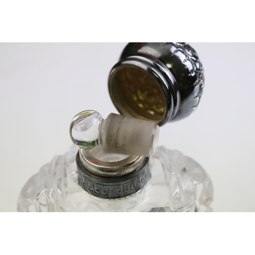490 - Group of silver topped cut glass scent bottles including four of orb form and one square example. Ea... 