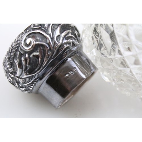 490 - Group of silver topped cut glass scent bottles including four of orb form and one square example. Ea... 