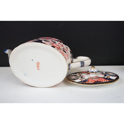 24 - Royal Crown Derby oval teapot, milk jug and lidded sugar basin decorated in the Imari pallete with 5... 