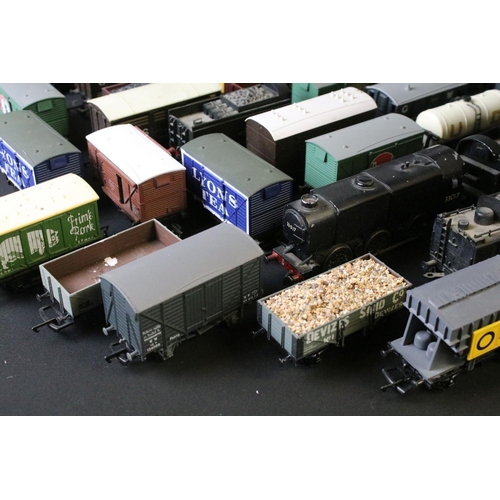 45 - Around 30 OO gauge items of rolling stock to include wagons and vans plus a built diecast metal loco... 