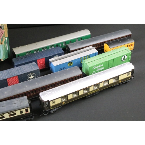 50 - Around 50 OO / HO gauge items of rolling stock to include coaches, mail coach, wagons and vans featu... 