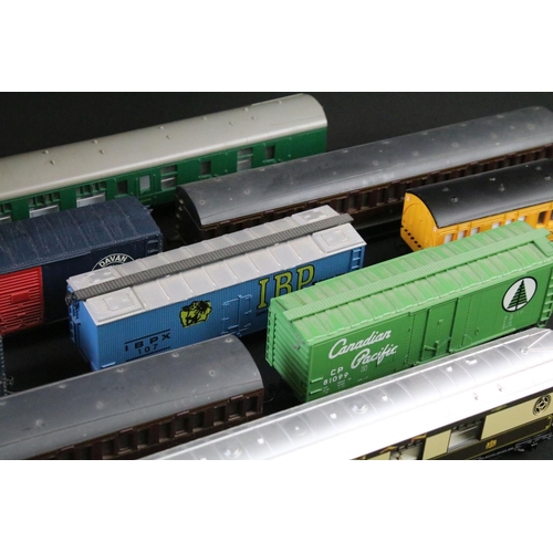 50 - Around 50 OO / HO gauge items of rolling stock to include coaches, mail coach, wagons and vans featu... 