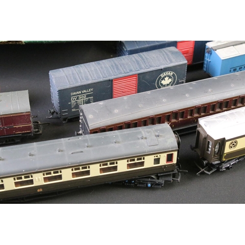 50 - Around 50 OO / HO gauge items of rolling stock to include coaches, mail coach, wagons and vans featu... 