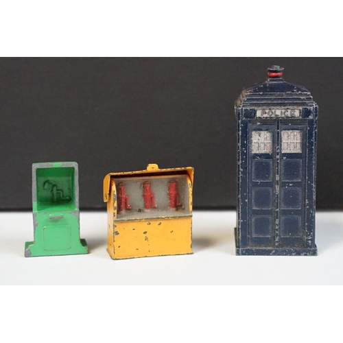 295 - Collection of Mid 20th C play worn metal roadside accessories to include 3 x telephone boxes, Police... 