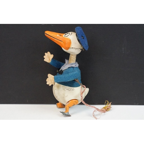 327 - Original Mid 20th C Schuco clockwork tin plate Donald Duck toy, with key, showing some wear and grub... 