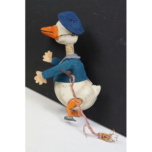 327 - Original Mid 20th C Schuco clockwork tin plate Donald Duck toy, with key, showing some wear and grub... 