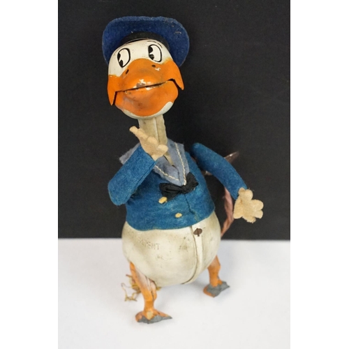 327 - Original Mid 20th C Schuco clockwork tin plate Donald Duck toy, with key, showing some wear and grub... 