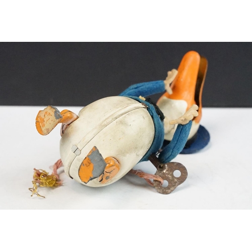 327 - Original Mid 20th C Schuco clockwork tin plate Donald Duck toy, with key, showing some wear and grub... 