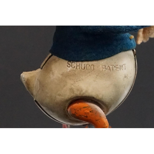 327 - Original Mid 20th C Schuco clockwork tin plate Donald Duck toy, with key, showing some wear and grub... 