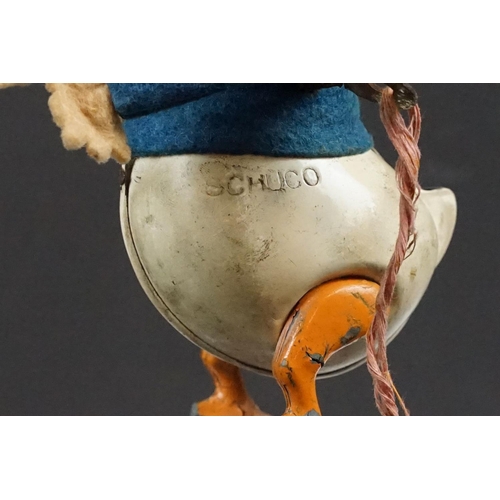 327 - Original Mid 20th C Schuco clockwork tin plate Donald Duck toy, with key, showing some wear and grub... 