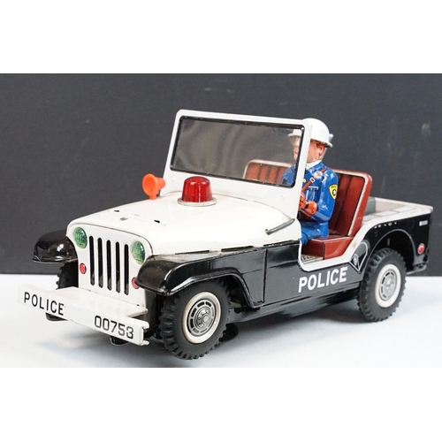 329 - Boxed TN Toys Japan Battery Operated Turn O Matic Gun Police Jeep, Jeep touch grubby otherwise gd, b... 