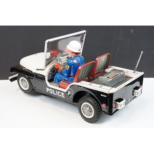 329 - Boxed TN Toys Japan Battery Operated Turn O Matic Gun Police Jeep, Jeep touch grubby otherwise gd, b... 