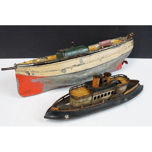 330 - Antique tin plate paddle wheel steam boat with handle and a metal painted motor boat, both showing w... 