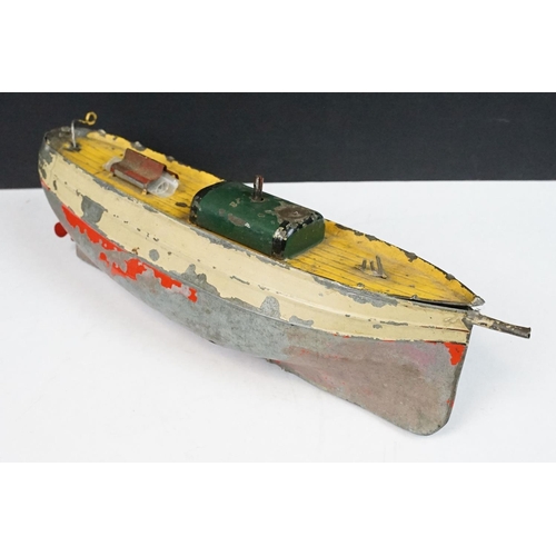 330 - Antique tin plate paddle wheel steam boat with handle and a metal painted motor boat, both showing w... 