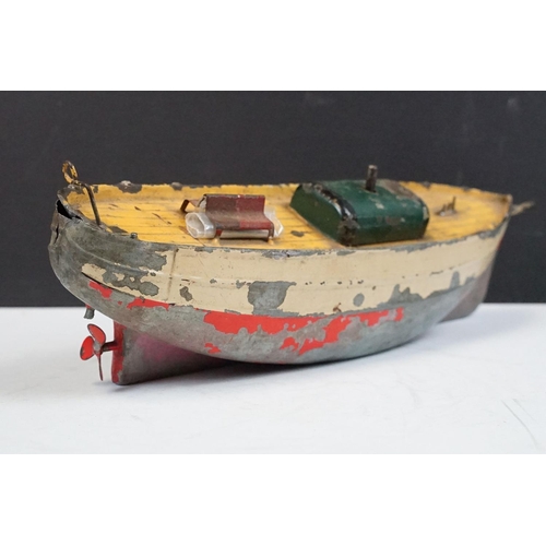 330 - Antique tin plate paddle wheel steam boat with handle and a metal painted motor boat, both showing w... 