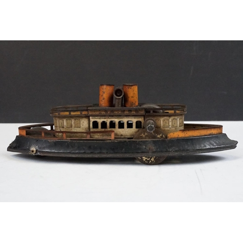 330 - Antique tin plate paddle wheel steam boat with handle and a metal painted motor boat, both showing w... 