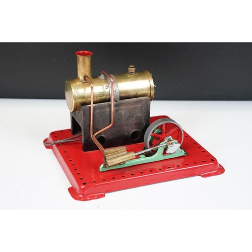 91A - Steam Engine - Mamod stationary steam engine with red base, cylindrical engine with turning wheel, m... 