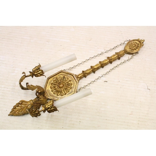 117 - Gilded carved wood pair of wall sconces with crystal garlands and flower and leaf detail. 67cm tall ... 