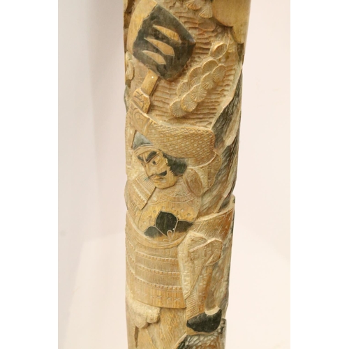 133 - Large carved Oriental Malacca decorative staff post with wolf and warrior scene.