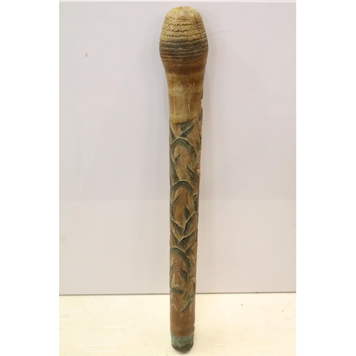 133 - Large carved Oriental Malacca decorative staff post with wolf and warrior scene.