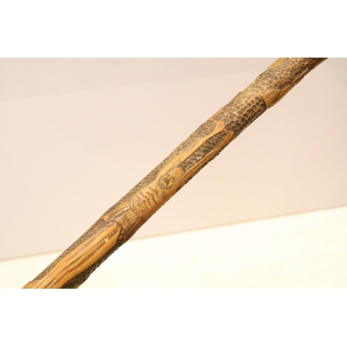 134 - Collection of five oriental carved walking cane stagger sticks with elaborate carvings and intricate... 