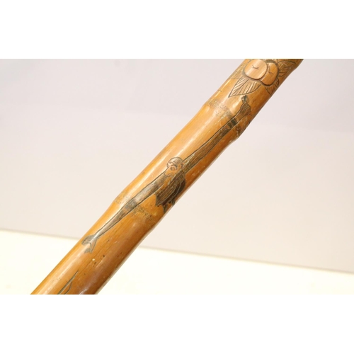 134 - Collection of five oriental carved walking cane stagger sticks with elaborate carvings and intricate... 