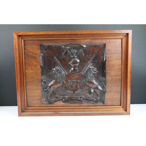 145 - Intricate gothic architectural wood carved panel in glass display case along with a 'Hold fast' mott... 