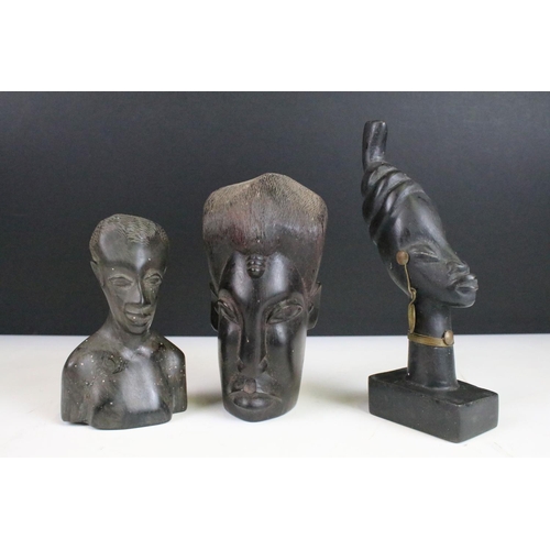 152 - Stone and wood carved assortment of small African heads and busts.