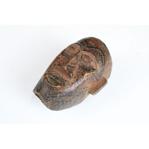 152 - Stone and wood carved assortment of small African heads and busts.