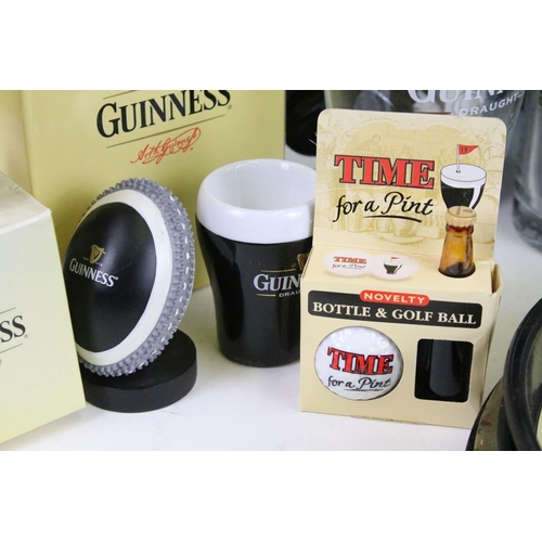 157 - Mixed Guinness promotional advertising items to include toucan salt and pepper pots, bottle clock, p... 