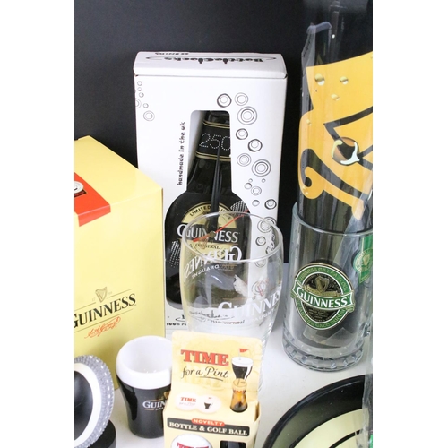 157 - Mixed Guinness promotional advertising items to include toucan salt and pepper pots, bottle clock, p... 