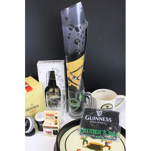 157 - Mixed Guinness promotional advertising items to include toucan salt and pepper pots, bottle clock, p... 